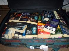 A suitcase full of mainly paperback fiction