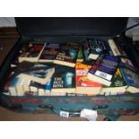 A suitcase full of mainly paperback fiction