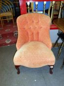 An orange upholstered bedroom chair