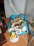A collection of animal figurines including Winnie the Pooh