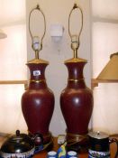 2 red pottery lamps