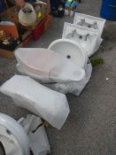 A large quantity of new wash basins, toilets and cisterns