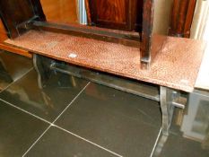 A copper topped coffee table