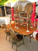 An oak dining table with 6 chairs