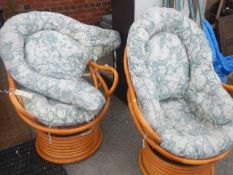 A pair of conservatory chairs