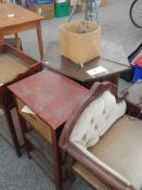 A telephone seat, a pair of bedsides and a table