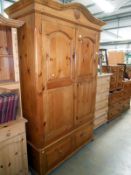 A pine double wardrobe with drawers