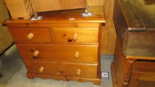 A pine 4 drawer chest of drawers