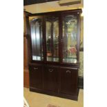 A darkwood stained 3 door / cupboard display cabinet with cut glass doors