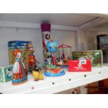 Quantity of tinplate clockwork toys some boxed inc. carousels, duck on bike, clever monkey etc.