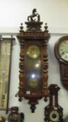 A long Victorian Vienna wall clock,