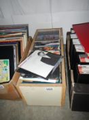 A box of mostly 1970/80's 45 rpm records