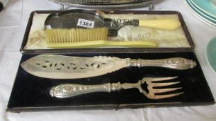 A cased Mappin & Webb pair of fish servers together with a crumb scoop and brush