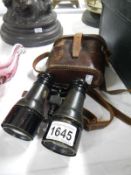 A good pair of early binoculars in original leather case,