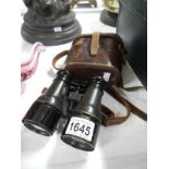 A good pair of early binoculars in original leather case,