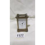 A miniature brass carriage clock marked Matthew Norman,