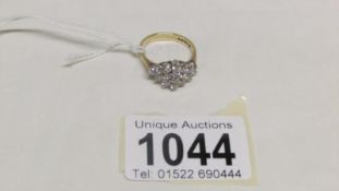 A 9ct gold diamond ring set 16 brilliant cut diamonds, calculated weight 1.