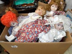 A box of porcelain collectors dolls