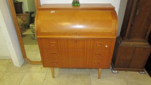 A good quality barrel fronted front bureau