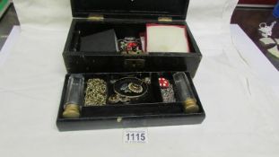 A jewellery box and contents including pair of gilt top scent bottles,