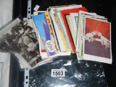 Approximately 90 comic/seaside postcards including Bonzo