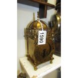 A brass Smith's lantern clock with wind up movement