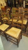 A set of 4 oak ladderback chairs