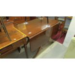 A mahogany drop leaf table