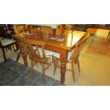 A pine kitchen table and 4 chairs