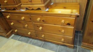 A solid pine 6 drawer side by side chest of drawers