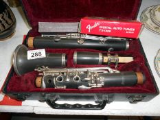 Cased clarinet with tutorial book,