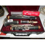 Cased clarinet with tutorial book,