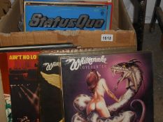 A box of albums including White Snake, Status Quo,