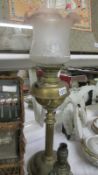 A Victorian brass column Young's oil lamp with later shade