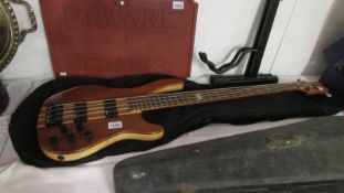 An electric bass guitar Ashton AB100 with stand