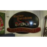 A Harley Davidson painted wall plaque