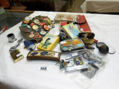 A mixed lot including badges, card games, lighters, cigarette cards & watches etc.