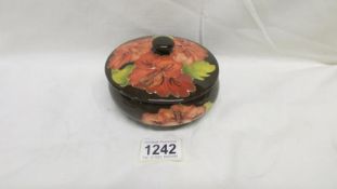 A Moorcroft brown hibiscus powder bowl and lid,