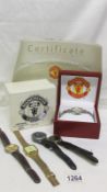 A cased Manchester United wrist watch with certificate and 4 others