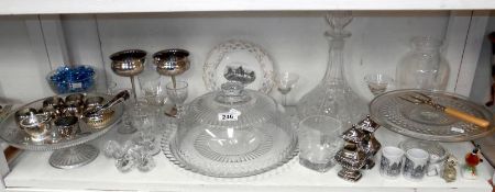 Shelf of glass and silver plate inc. cake stands, decanter etc.