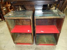 A pair of wooden crates as bedside cabinets with glass top