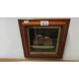 An early 20th century wool work of house in original frame