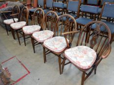 A set of 6 fleur de lys back chairs including 2 carvers