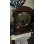 A mid 19th century rosewood bracket clock with mother of pearl inlay,
