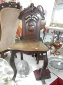 A 19th century shield back hall chair