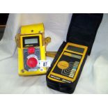 2 insulation and continuity testers with cases and cables