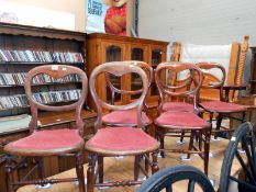 A set of 6 Victorian spoon back chairs