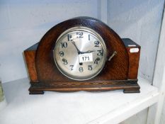 An oak mantel clock