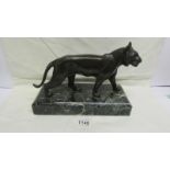 A bronze tiger on marble base