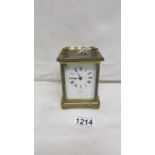 A brass carriage clock by Dyson & Son,